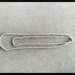 Hand made beaded Necklace. White beads, slightly iridescent. Versatile